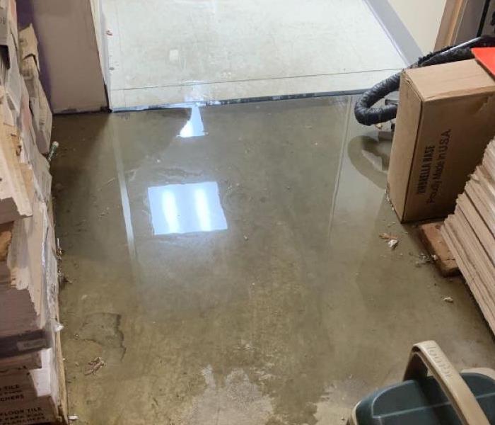 Storage Area with water pooling on concrete floor