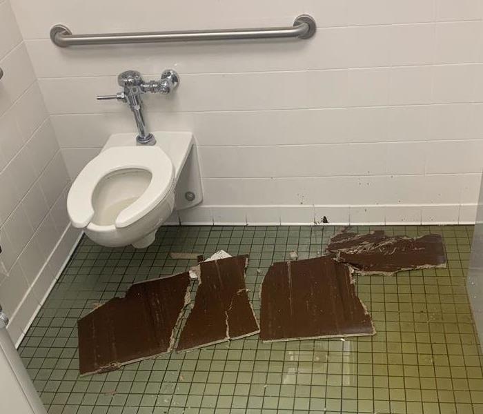 Water Damage in Men's Room