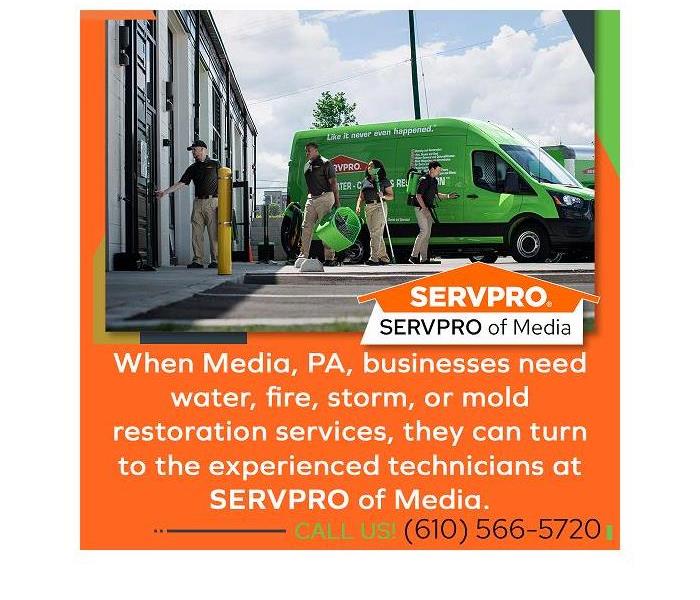 SERVPRO team with equipment and truck